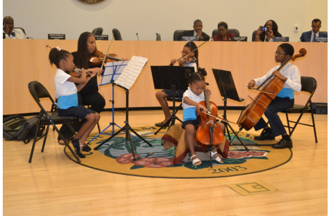 Emma and siblings representing Florida Youth Orchestra at Miami City Hall